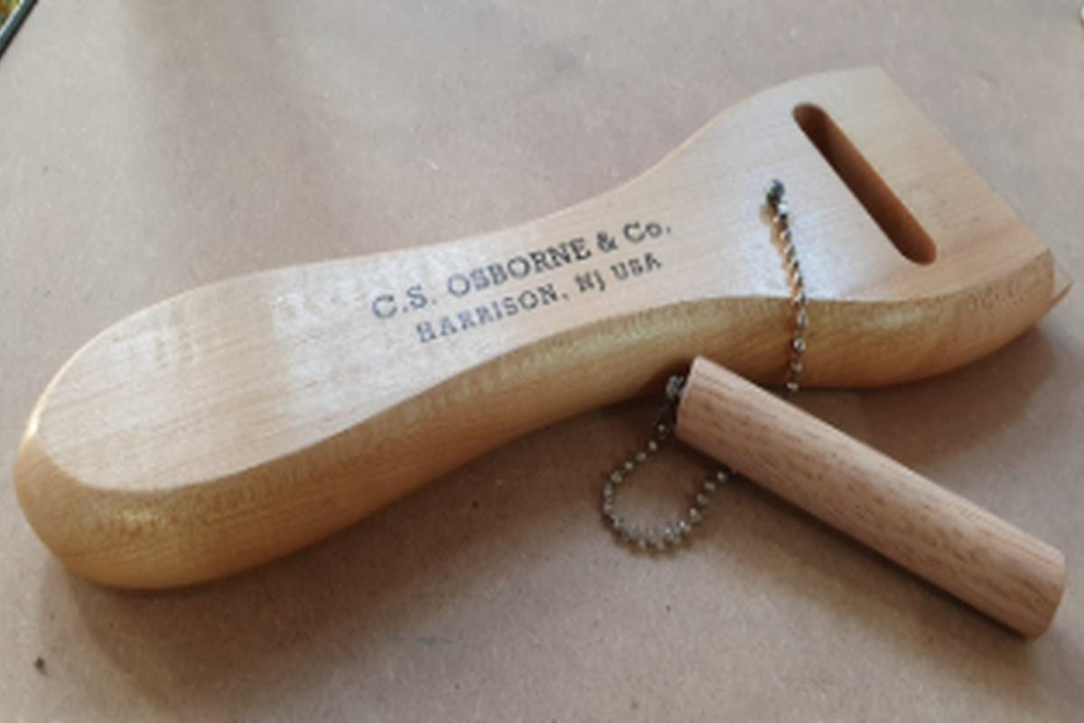 Tandloze singelspanner voor elastische singelband